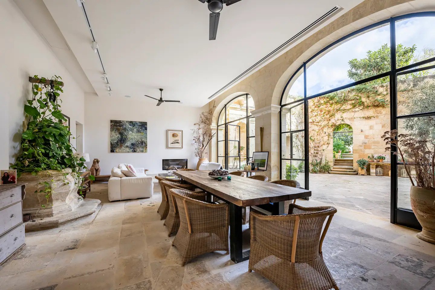Elegant dining room with stone walls and a long table